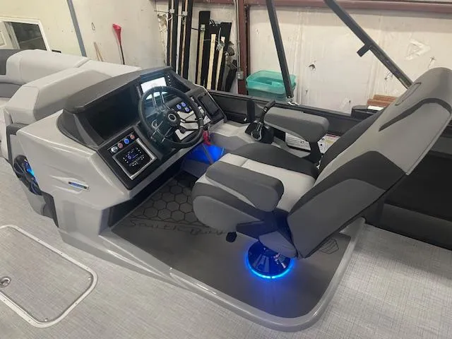 Slide: The Image of 2025 South Bay 500 boat interior with modern dashboard and illuminated captain's chair. - 7