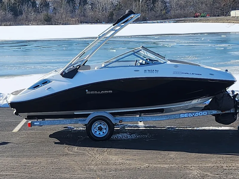 Slide: The Image of 2012 Sea-Doo Sport Boats 180 Challenger SE on trailer by frozen lake. - 0