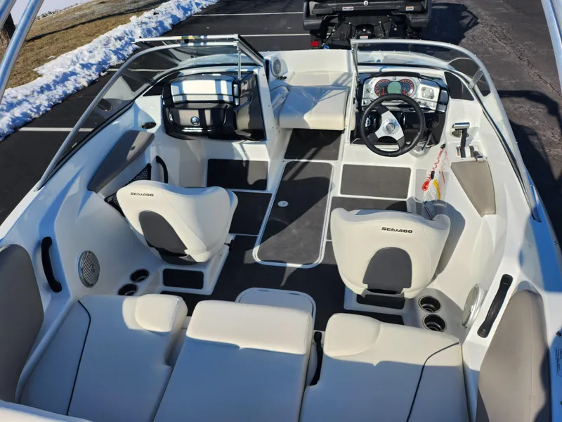 Slide: The Image of 2012 Sea-Doo 180 Challenger SE boat interior with seating and dashboard. - 10