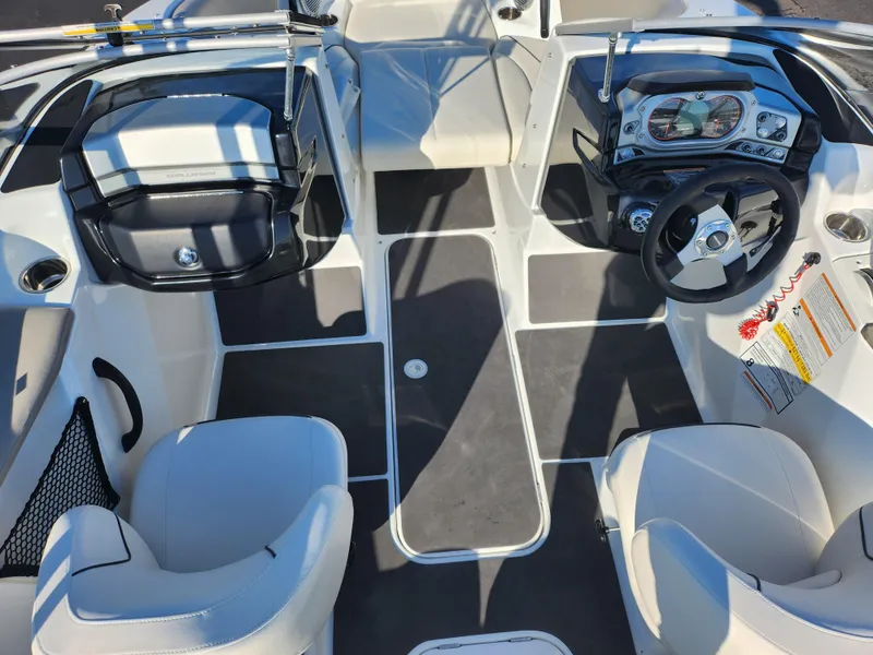 Slide: The Image of 2012 Sea-Doo 180 Challenger SE interior with steering wheel and seating. - 11