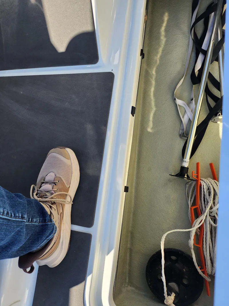 Slide: The Image of 2012 Sea-Doo 180 Challenger SE interior with foot, ropes, and equipment. - 14