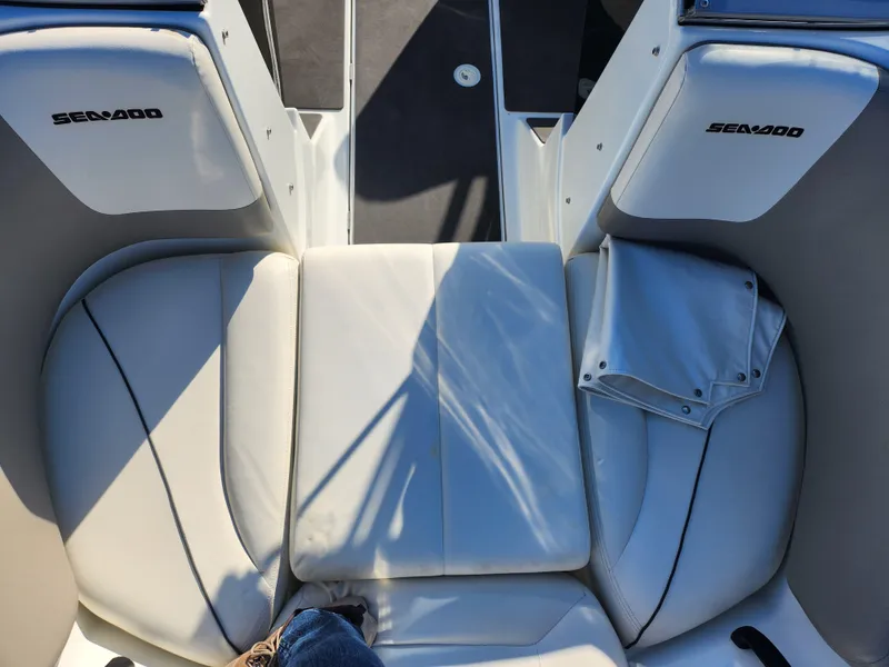 Slide: The Image of 2012 Sea-Doo 180 Challenger SE boat interior with white seating and Sea-Doo branding. - 17