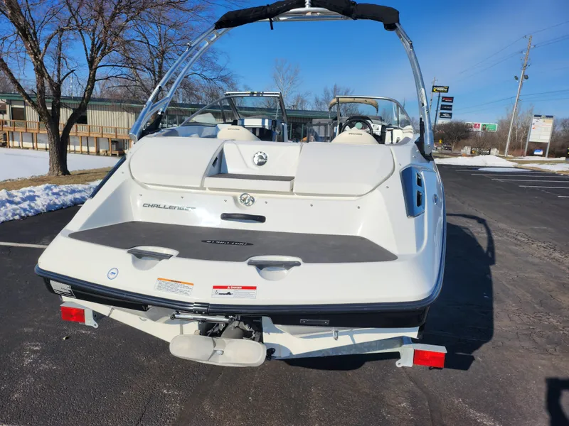 Slide: The Image of 2012 Sea-Doo Sport Boats 180 Challenger SE, rear view, parked outdoors. - 2