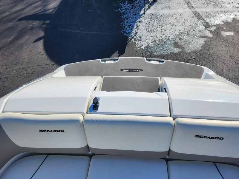 Slide: The Image of 2012 Sea-Doo Sport Boats 180 Challenger SE rear view, white seating, outdoor setting. - 21