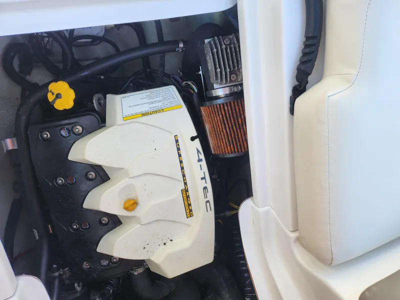 Slide: The Image of 2012 Sea-Doo 180 Challenger SE engine compartment with visible components and wiring. - 22