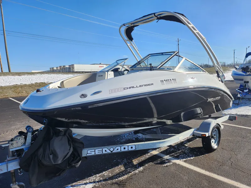 Slide: The Image of 2012 Sea-Doo Sport Boats 180 Challenger SE on trailer, parked outdoors. - 5