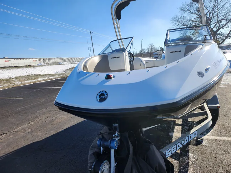 Slide: The Image of 2012 Sea-Doo 180 Challenger SE boat on trailer in sunny parking lot. - 6