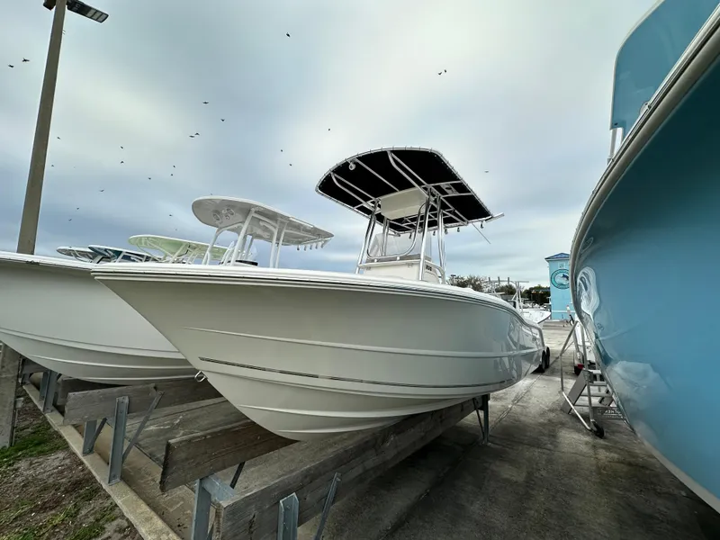 The Image of 2025 Bulls Bay 200 Center Console boat displayed in a marina setting. - 1