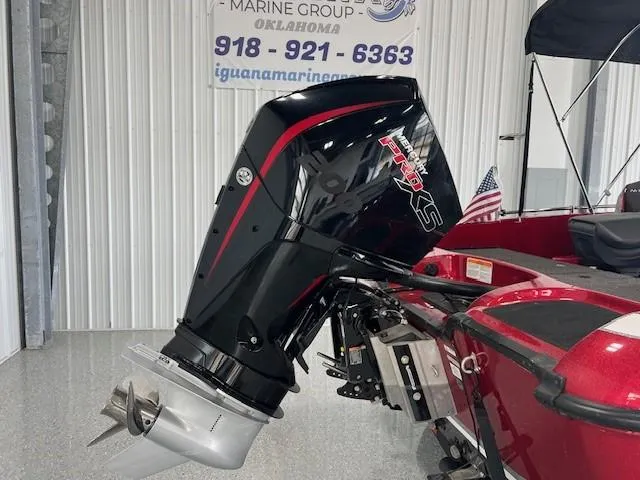 Slide: The Image of 2020 Nitro ZV19 Pro boat engine in showroom, featuring sleek black and red design. - 3