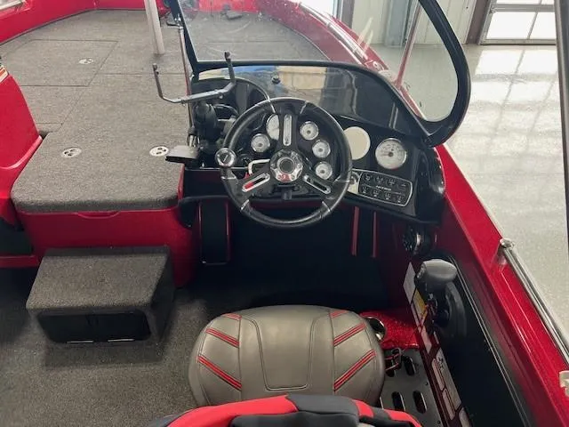 Slide: The Image of 2020 Nitro ZV19 Pro boat cockpit with steering wheel and dashboard controls. - 6