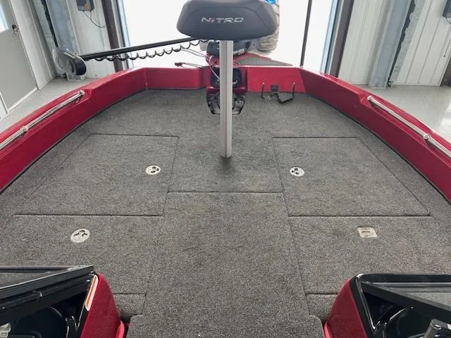 Slide: The Image of 2020 Nitro ZV19 Pro boat interior with carpeted deck and storage compartments. - 8