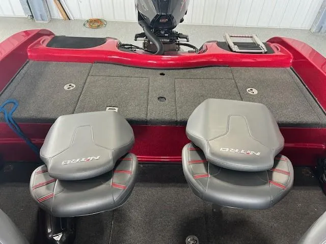 Slide: The Image of 2020 Nitro ZV19 Pro boat interior with gray seats and red accents. - 9