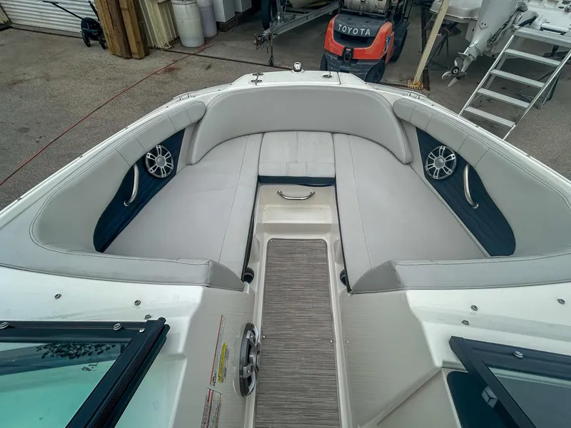 Slide: The Image of 2023 Sea Ray SPX 190 OB boat interior with cushioned seating and speakers. - 5