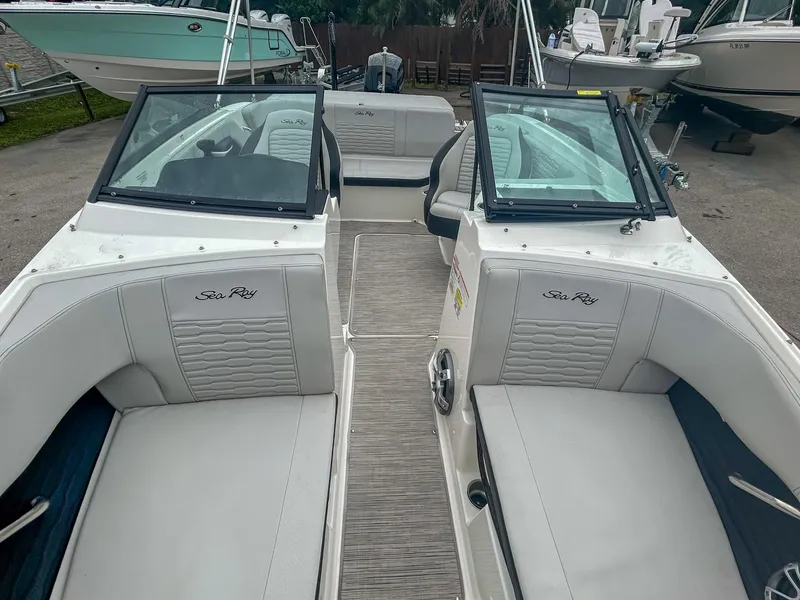 Slide: The Image of 2023 Sea Ray SPX 190 OB boat interior with dual seating and windshield. - 6