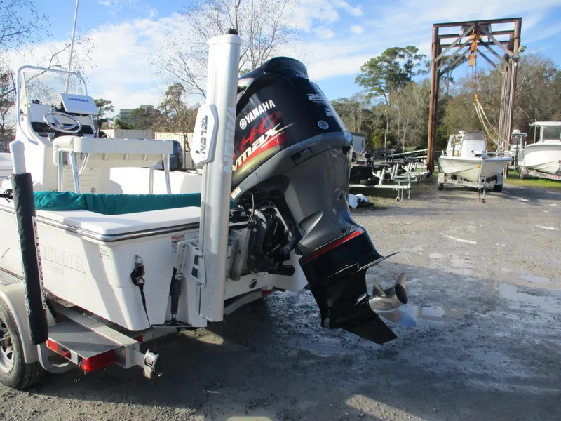 Slide: The Image of 2011 Pathfinder 2200 XL boat with Yamaha outboard motor in a marina setting. - 4