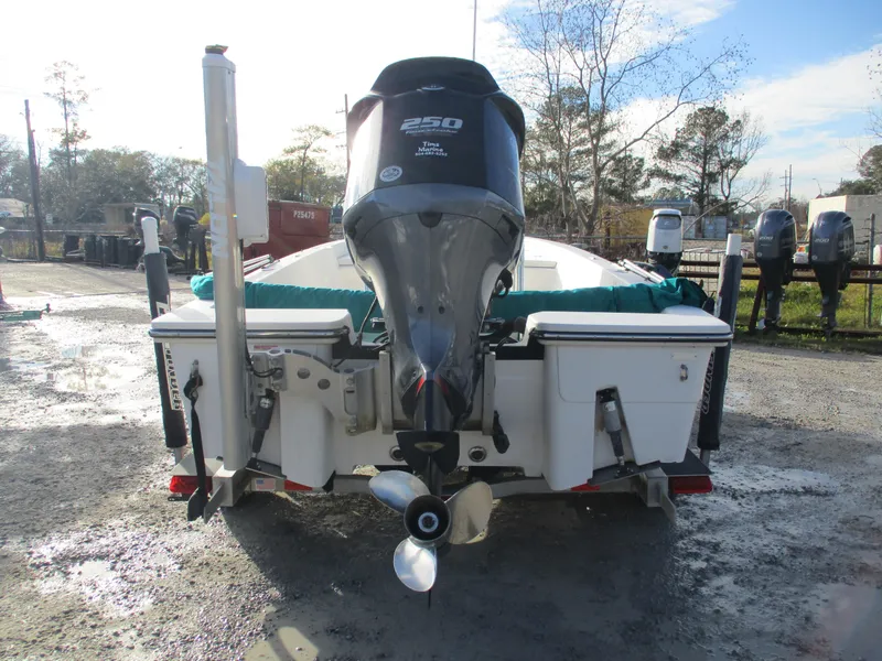 Slide: The Image of 2011 Pathfinder 2200 XL boat with powerful outboard motor, parked outdoors. - 5