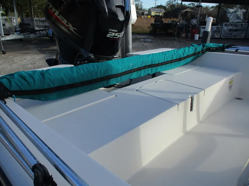 Slide: The Image of 2011 Pathfinder 2200 XL boat interior with Yamaha 250 engine, teal cover, and storage compartments. - 8