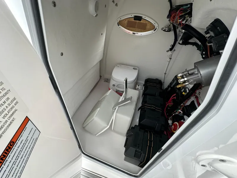 Slide: The Image of 2025 Twin Vee 240 GFX CC boat interior with wiring and equipment. - 11