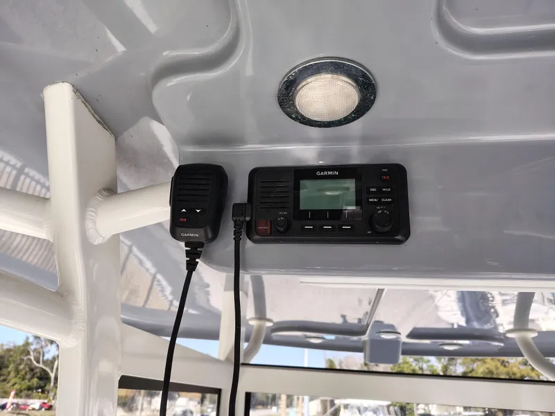 Slide: The Image of 2024 Parker 2900 Center Console boat interior with radio and light fixture. - 13