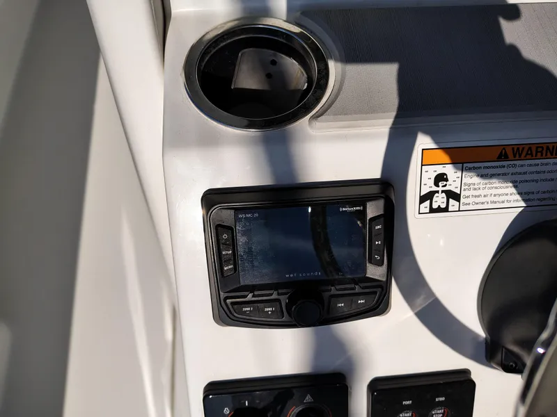 Slide: The Image of 2024 Parker 2900 Center Console dashboard with controls and warning label. - 18