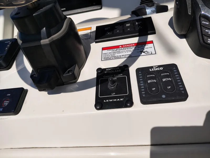 Slide: The Image of Control panel of 2024 Parker 2900 Center Console boat with various switches and controls. - 19
