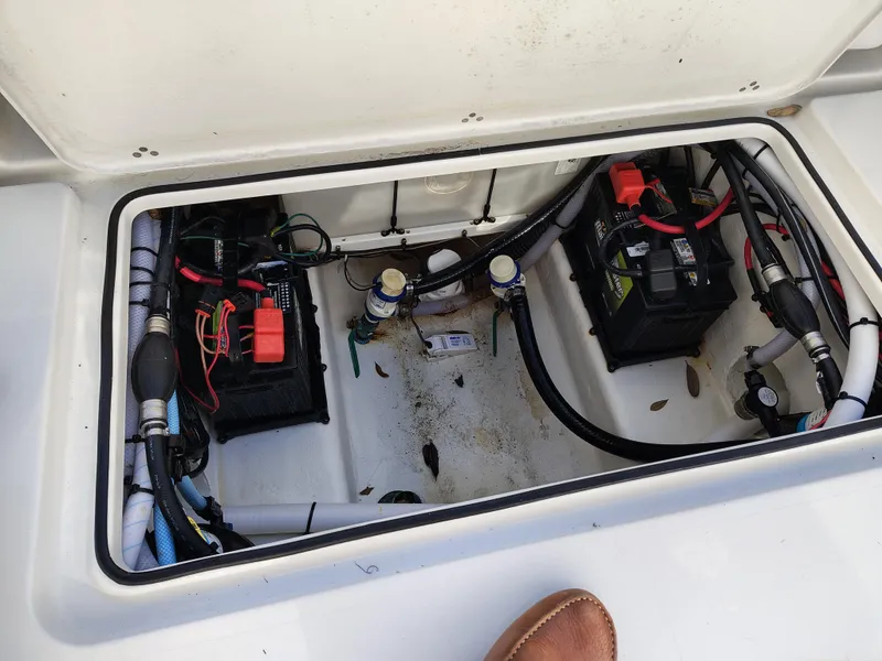 Slide: The Image of 2024 Parker 2900 Center Console boat battery compartment with wiring and connections. - 20