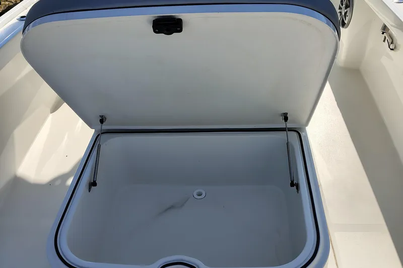 Slide: The Image of Open storage compartment on 2024 Parker 2900 Center Console boat. - 22