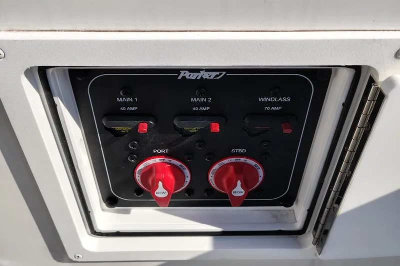 Slide: The Image of 2024 Parker 2900 Center Console control panel with switches and dials. - 23