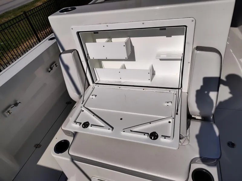 Slide: The Image of 2024 Parker 2900 Center Console boat interior storage compartment open. - 8