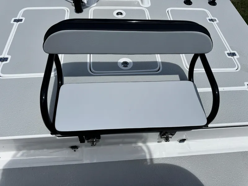 Slide: The Image of SCB S22 2025 boat seat with black frame and white cushions. - 12