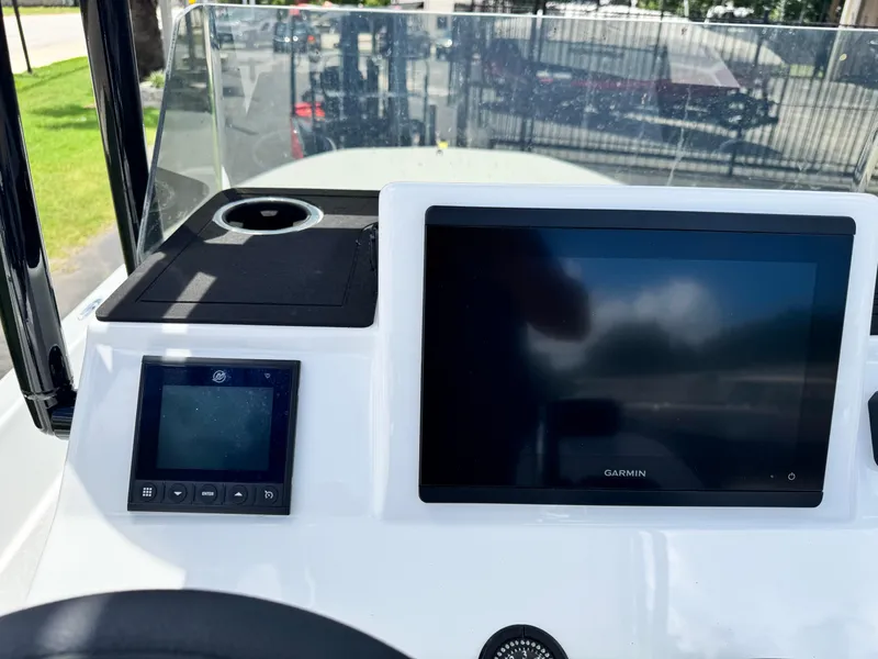 Slide: The Image of 2025 SCB S22 boat dashboard with Garmin display and controls. - 17