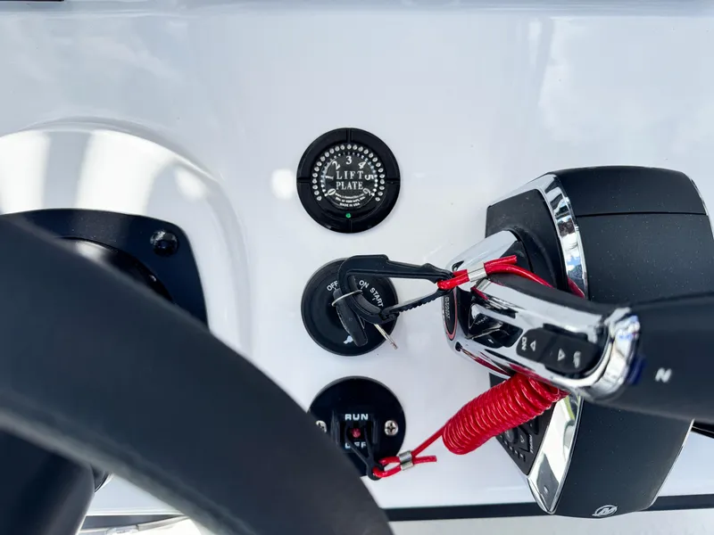 Slide: The Image of Control panel of SCB S22 boat, featuring throttle and lift plate gauge, 2025 model. - 19