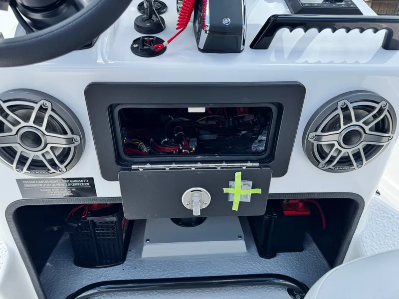 Slide: The Image of 2025 SCB S22 boat dashboard with speakers and storage compartment. - 21