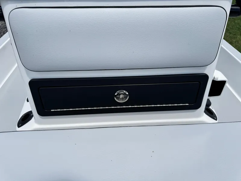 Slide: The Image of 2025 SCB S22 boat storage compartment with lock, featuring sleek design and white finish. - 26