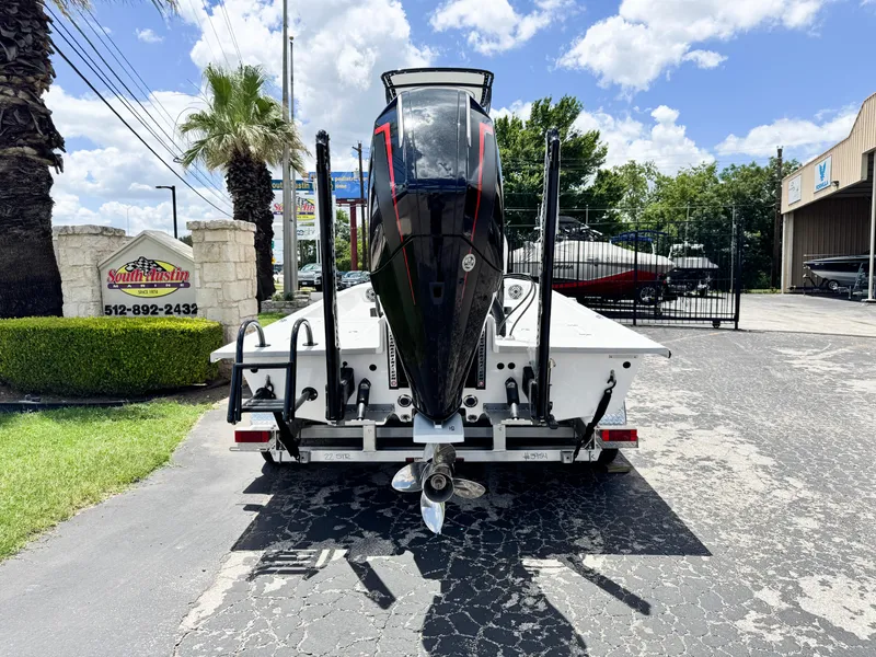 Slide: The Image of 2025 SCB S22 boat on trailer, parked outdoors under a sunny sky. - 3