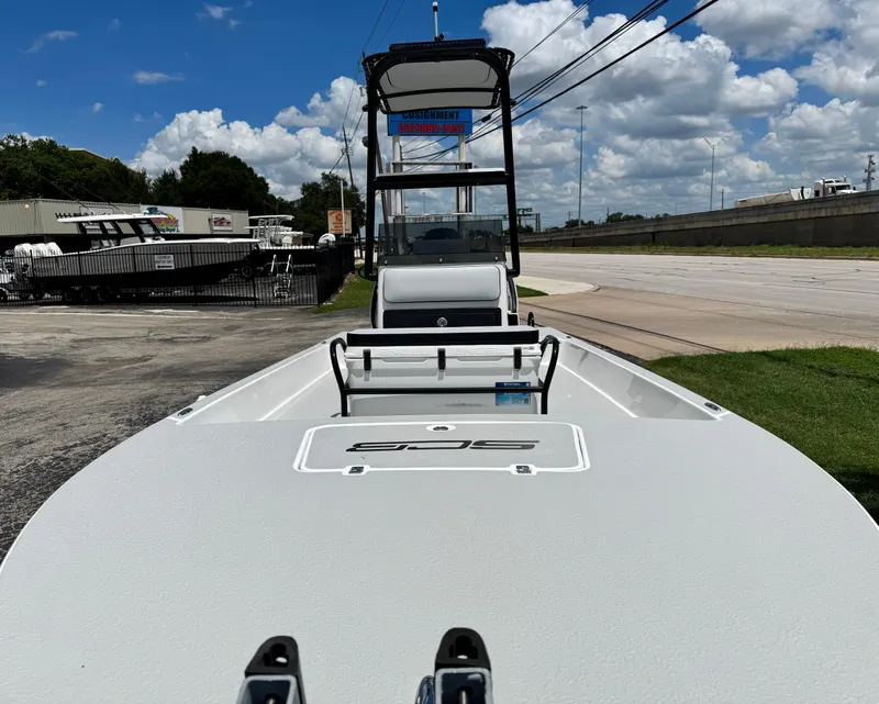 Slide: The Image of 2025 SCB S22 boat on display under a clear blue sky. - 6