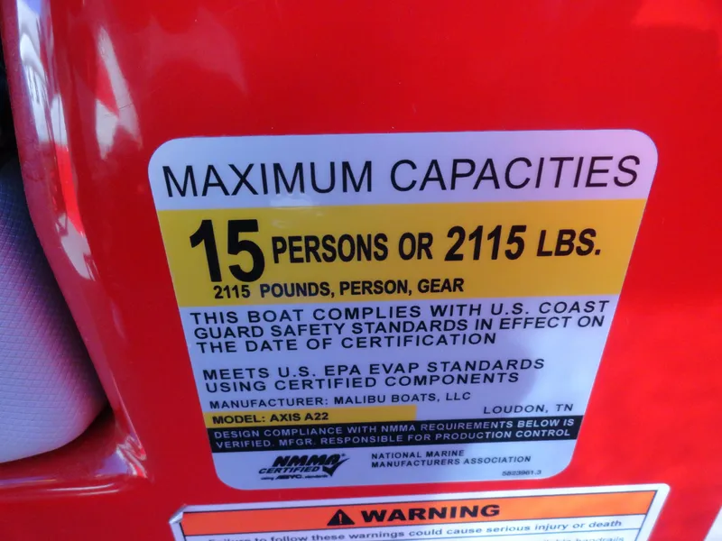 Slide: The Image of 2016 Axis A22 boat capacity label, max 15 persons or 2115 lbs, Coast Guard compliant. - 17