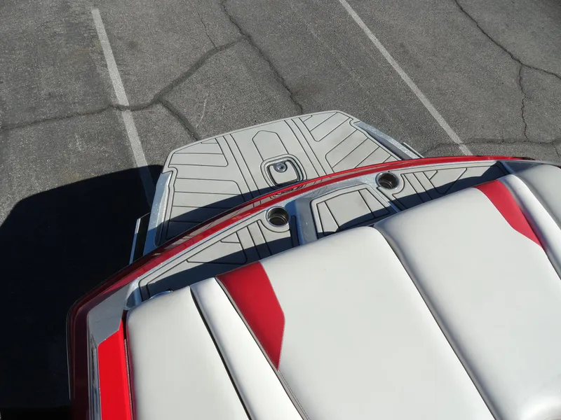 Slide: The Image of 2016 Axis A22 boat with red and white upholstery, viewed from above. - 23