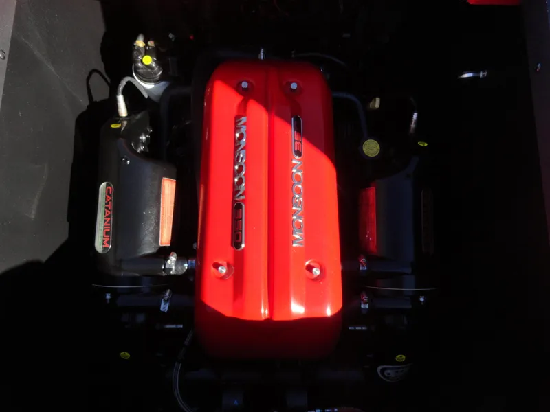 Slide: The Image of 2016 Axis A22 engine with red Monsoon cover, showcasing powerful performance components. - 24