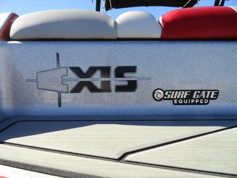 Slide: The Image of 2016 Axis A22 boat with Surf Gate technology, featuring sleek design and branding. - 3
