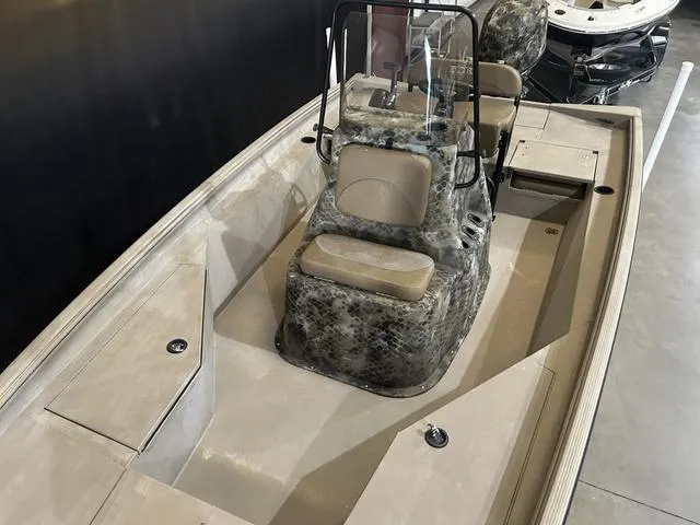 Slide: The Image of 2022 Excel Bay Pro 203 boat with camouflage seating and center console. - 10