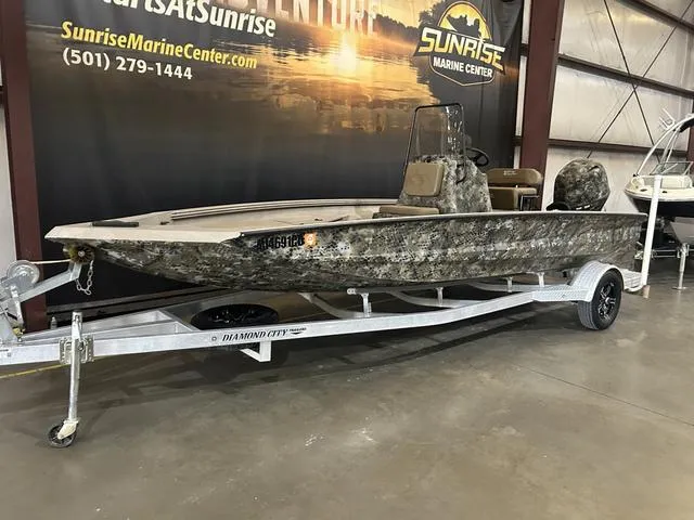 Slide: The Image of 2022 Excel Bay Pro 203 boat on trailer at Sunrise Marine Center. - 2