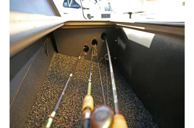 Slide: The Image of 2022 Excel Bay Pro 203 fishing rod storage compartment with rods. - 34