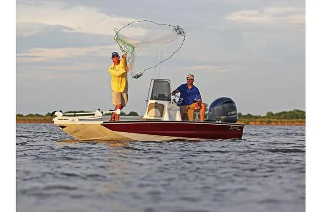 Slide: The Image of Two people fishing on a 2022 Excel Bay Pro 203 boat. - 40