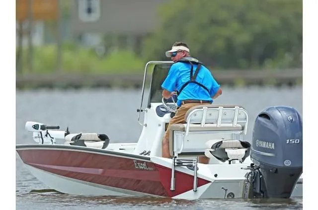 Slide: The Image of 2022 Excel Bay Pro 203 boat with Yamaha engine on water. - 42