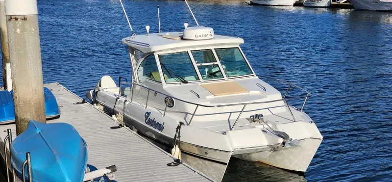 Slide: The Image of 2016 World Cat 2780 Glacier Bay Edition boat docked on calm water. - 0