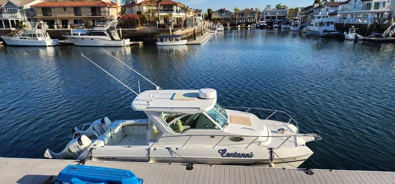Slide: The Image of 2016 World Cat 2780 Glacier Bay Edition boat docked in a scenic marina. - 1
