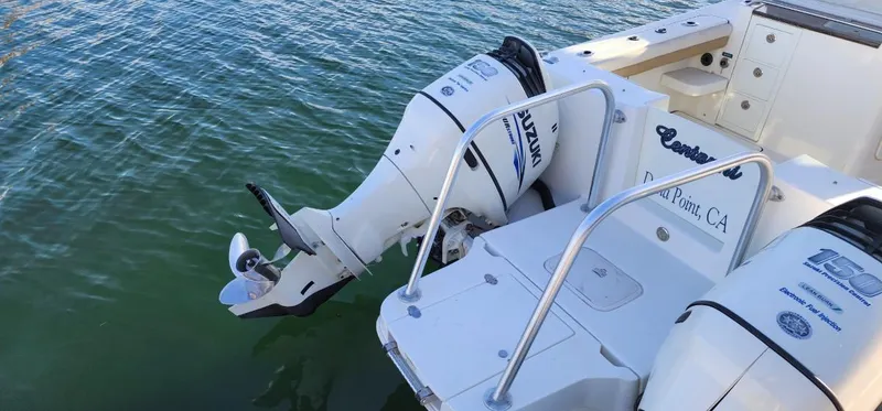 Slide: The Image of 2016 World Cat 2780 Glacier Bay Edition boat with Suzuki outboard motors on water. - 13