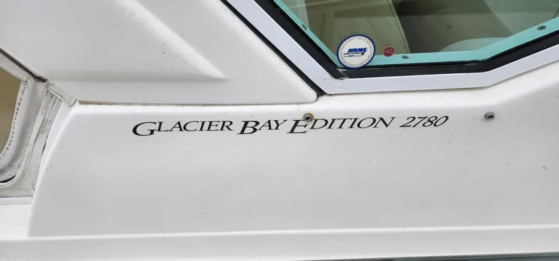 Slide: The Image of 2016 World Cat 2780 Glacier Bay Edition boat side view with model name. - 15