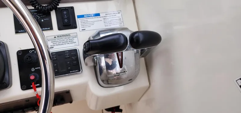 Slide: The Image of 2016 World Cat 2780 Glacier Bay Edition boat controls and steering wheel. - 22